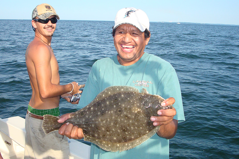 Fishing Charters Flounder Fish Caught by Happy Angler