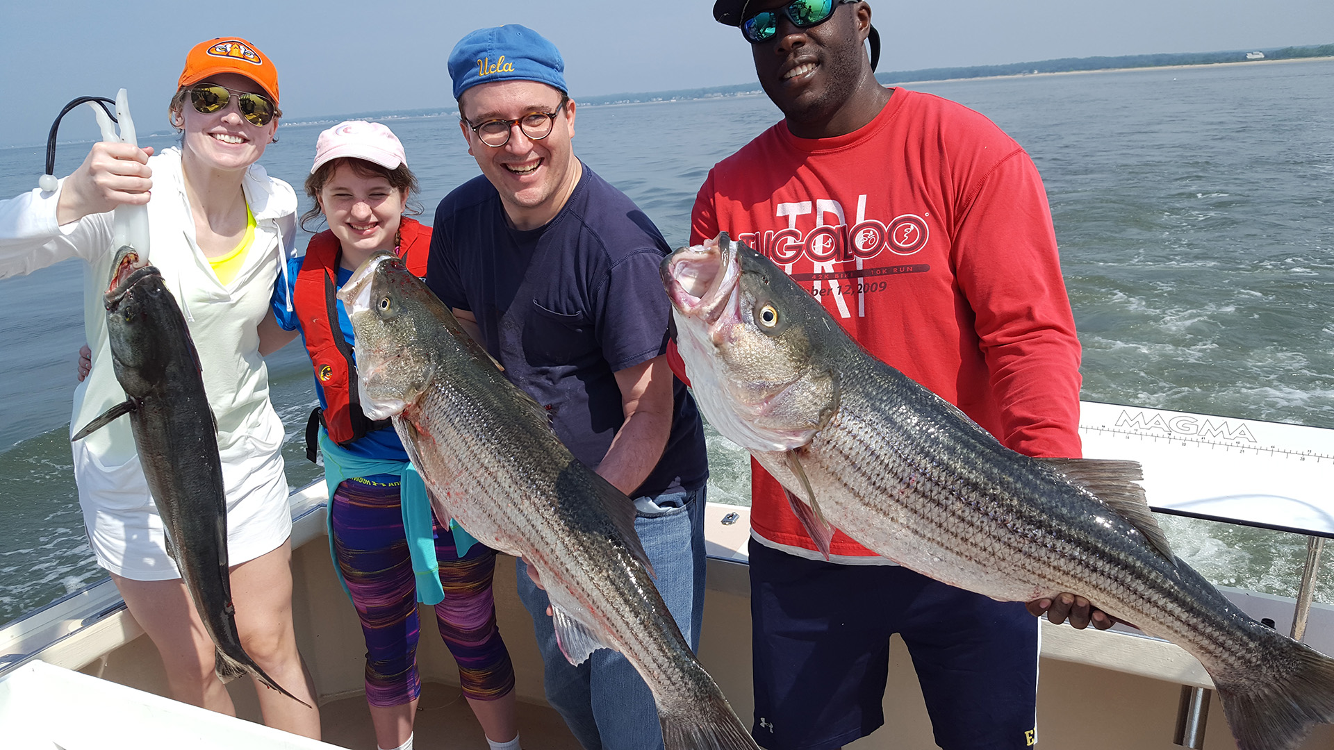 Happy Family with the Fish They Caught in CT