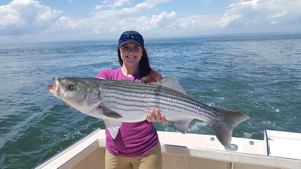 Girl with Striped Bass